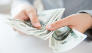 Hands holding money-Deposit Photos
