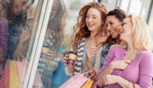 Happy shoppers, friends shopping, women with shopping bags, happy women Depositphotos